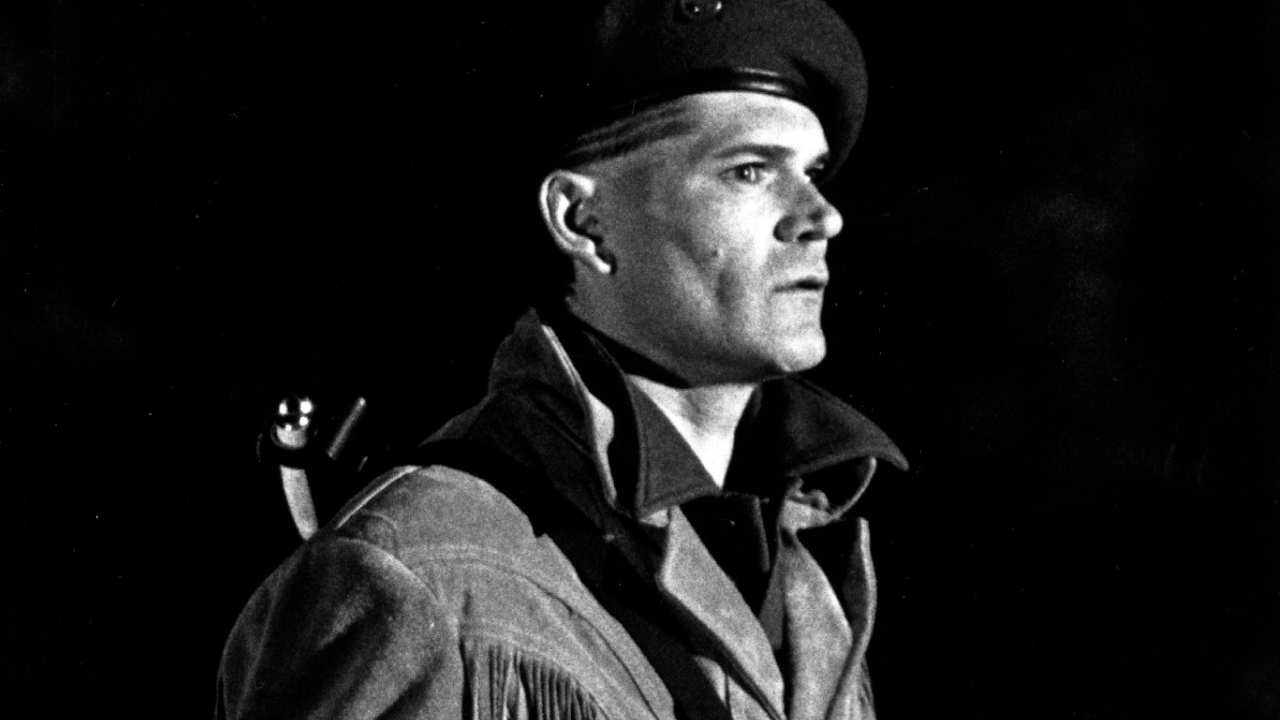 a man with a beret and a fringe suede jacket